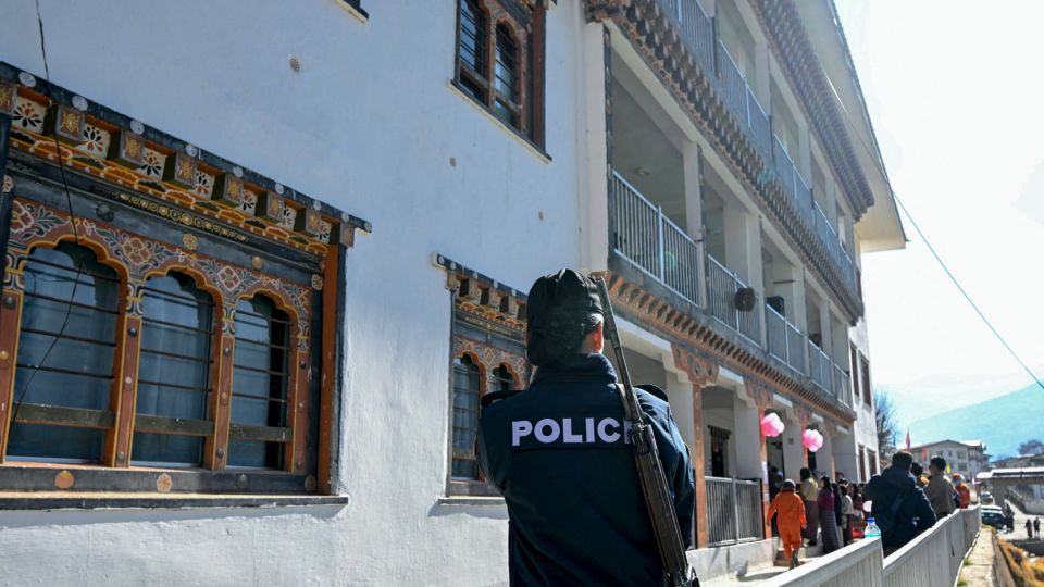 Thematic image only. A police personnel stands guard at a polling station during general elections in Thimphu on January 9, 2024. PHOTO: AFP