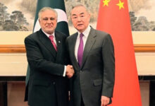 Chinese Foreign Minister Wang Yi (right) greets Deputy Prime Minister and Foreign Minister Ishaq Dar in Beijing on May 20, 2025. — X@ForeignOfficePk