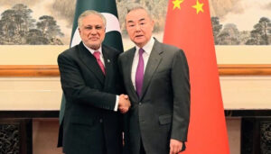 Chinese Foreign Minister Wang Yi (right) greets Deputy Prime Minister and Foreign Minister Ishaq Dar in Beijing on May 20, 2025. — X@ForeignOfficePk