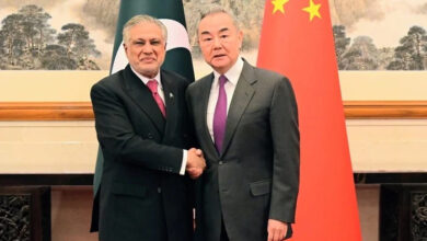 Chinese Foreign Minister Wang Yi (right) greets Deputy Prime Minister and Foreign Minister Ishaq Dar in Beijing on May 20, 2025. — X@ForeignOfficePk